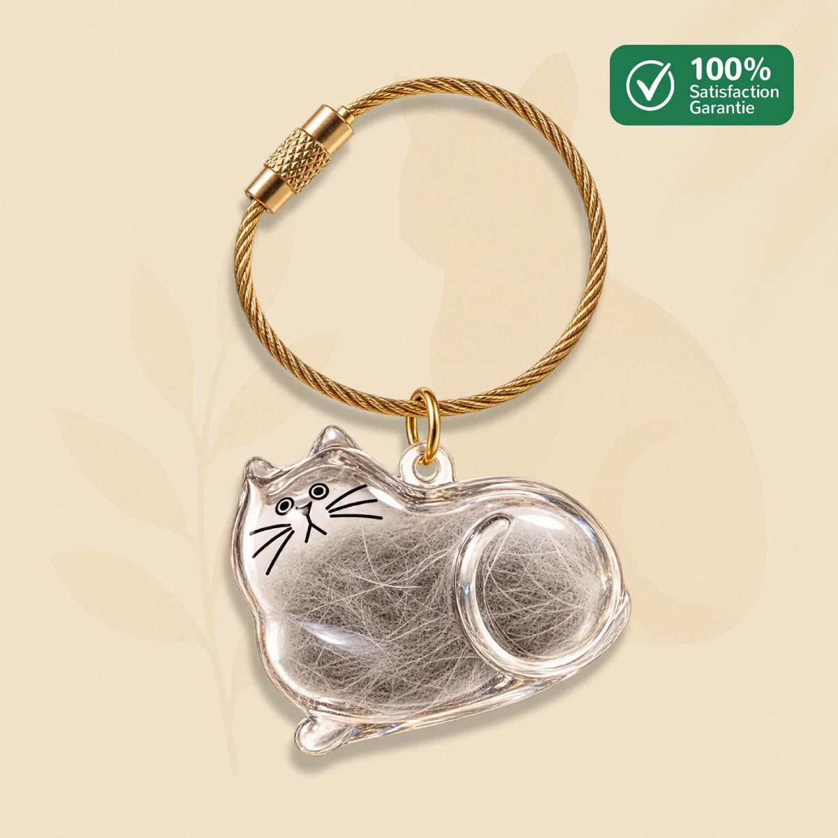 Porte-clés commémoratif PurrKey en forme de chat couché avec poils gris visibles dans le boîtier transparent